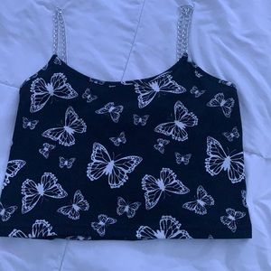 Blackand white butterflycrop topwith achain straps